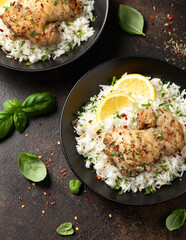 Grilled Chicken thighs served with rice in a black bowl