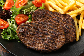 Peppered Vegetarian steaks served with french fries and salad