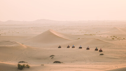 Fototapeta na wymiar Quadro cycles in the desert
