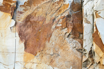 Abstract texture of smooth yellow stone, cracked rock for background