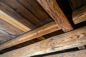 Old roof frame made of wooden beams, old wood