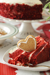 Piece of red velvet cake with perfect texture on the white plate. Slice of delicious homemade red velvet cake. Copy space for text. High quality vertical photo.
