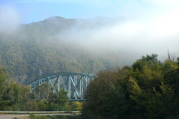 Fototapeta premium road and bridge in the morning fog