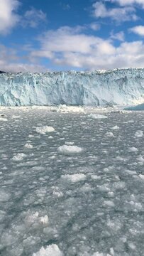 Eqi Glacier Calving, view of shattered glacial ice covering Arctic ocean surface near face of Eqi Glacier, Ilulissat, west Greenland, Greenland, Unesco World Heritage Site

