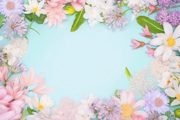 Colorful Flowers Arranged in a Circle on a Dreamy Pastel Blue and Pink Botanical Background