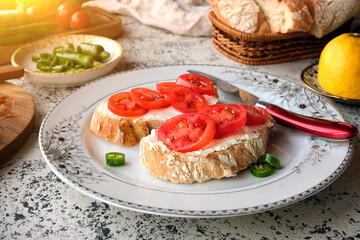 Close-up of fresh cherry tomatoes bruschetta with cream cheese.