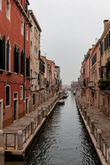 Fototapeta na wymiar Venice, view of a canal on a misty day, old gothic buildings, 
