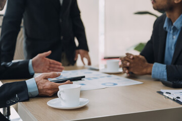 Entrepreneurs and business people conference in modern meeting room, happy multiracial coworkers have fun cooperating working together at office meeting, asian teamwork concept
