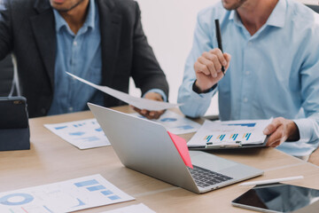 Entrepreneurs and business people conference in modern meeting room, happy multiracial coworkers have fun cooperating working together at office meeting, asian teamwork concept