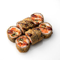 Fried hot sushi rolls set with fish, cucumber, red sauce and unagi sauce. Japanese, Asian cuisine. Seafood dishes. White background. Top view. Soft focus. Copy space. 