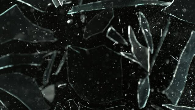 Super Slow Motion Shot of Breaking Real Glass at 1000 fps. Isolated on Black Background.