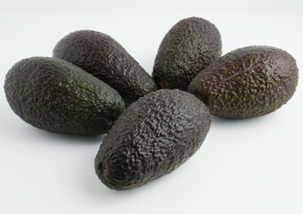 Tropical fruit, avocado on white background