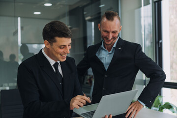 Entrepreneurs and business people conference in modern meeting room, happy multiracial coworkers have fun cooperating working together at office meeting, asian teamwork concept