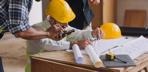 Diverse Team of Specialists Use Tablet Computer on Construction Site. Real Estate Building Project with Civil Engineer, Architect, Business Investor and General Worker Discussing Plan Details.