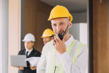 Diverse Team of Specialists Use Tablet Computer on Construction Site. Real Estate Building Project with Civil Engineer, Architect, Business Investor and General Worker Discussing Plan Details.