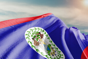 Belize national flag cloth fabric waving on beautiful grey background.