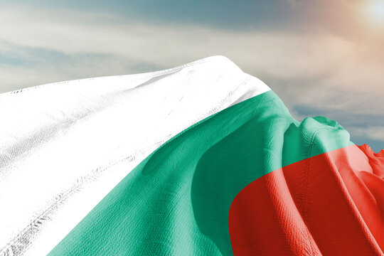 Bulgaria national flag cloth fabric waving on beautiful grey background.