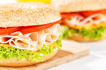 Bagel sandwich with chicken ham for breakfast close up