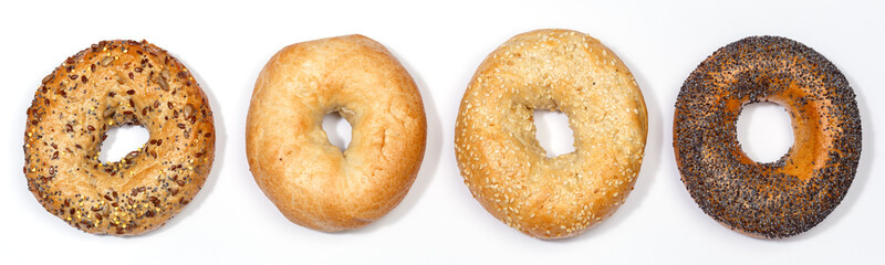 Assorted bagels sandwich for breakfast bagel from above isolated on a white background - obrazy, fototapety, plakaty