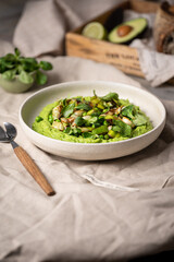 Mashed green peas with leek in a bowl