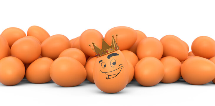 Group of farm brown chicken eggs and unique egg with funny face and gold crown
