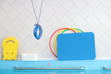 Children's swimming pool with various items. Selective focus.