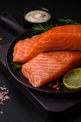 Fresh tasty raw red fish fillet with spices and herbs