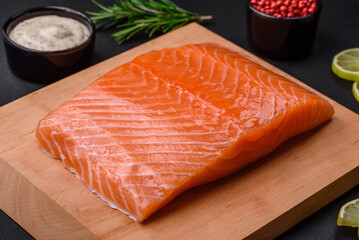 Fresh tasty raw red fish fillet with spices and herbs