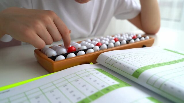 The boy is engaged in abacus, mental arithmetic for children