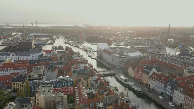 Flying over Nyhavn in Copenhagen at dusk