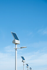 Obraz premium sustainable public lighting of solar energy. streetlight powered with green, photovoltaic energy lamp