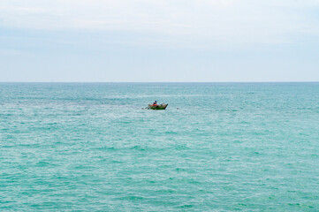 Fishing boat with fishermen in the ocean. Photography for tourism background, design and advertising. 10 January 2023, Sooriya hotel spa, Sri Lanka
