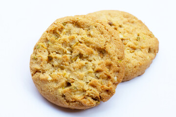 Pistachio and almond cookies on white background.