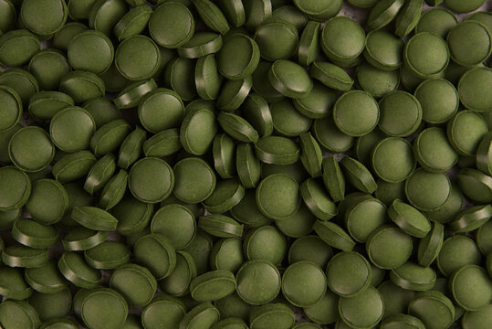 Green tablets of bio chlorella. A health-promoting dietary supplement rich in vitamins. Chlorella vulgaris.