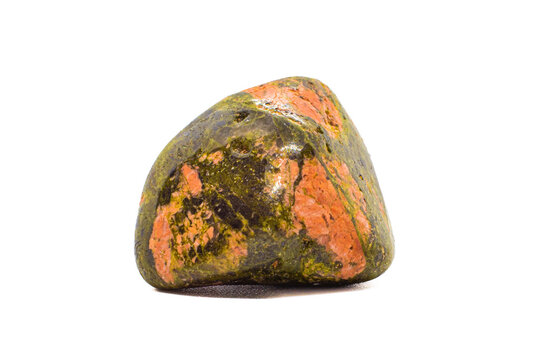 Macro tumbled green and orange unakite jasper crystal, silicate chalcedony mineral variety, isolated on a white surface background  