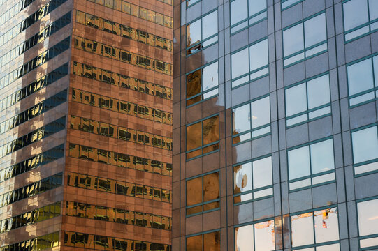 Reflections of abstract buildings on the glass of one of the beautiful huge skyscrapers
