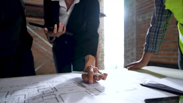 Team of experts or groups of civil engineers work together on a construction site.