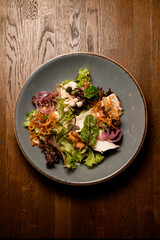 top view on salad with fresh leaves of green and lettuce on plate