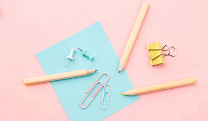 Stationery items for girls or women on light pink background. Back to school. Female Student's, pupil's or engineer's supplies. Office objects on pastel pink background