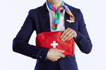 Closeup on stylish flight attendant woman on white