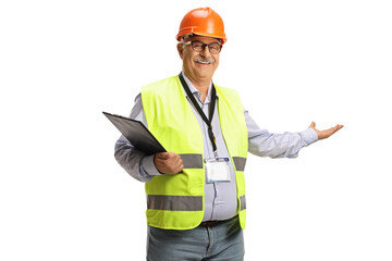 Mature male engineer with a safety vest showing with hand