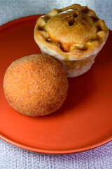 Traditional street food in UK, stuffed fried Scotch eggs with breadcrumbs and baked pie with pork meat