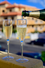 Dinner party, drinking of cava or champagne sparkling wine in vacation resort Caleta Fuste, Fuerteventura, Canary islands vacation, Spain