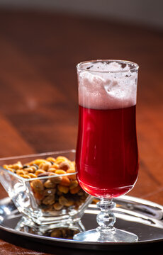 Glass Of Belgian Fruity Red Sour Cherry Kriek Beer And Party Mix Nuts, Pairing Of Food And Beer In Belgium