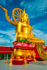 Koh Samui, Thailand - December 30, 2018: big Buddha Temple sits on a small rocky island off Koh Samui , its golden, 12-metre-tall seated Buddha statue is one of the islands most popular attractions © sphraner