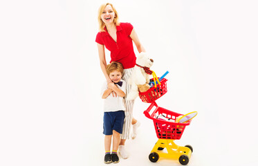 Happy family mother and son with shopping basket and shopping cart with sport equipment on shop. Mother with son on shopping. Sale. Discount. Black friday. Buying spree. Advertising.