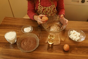 Close-up shot of making cookies. Detail shot of eggs, flour and margarine. Sunset concept, warm tones.