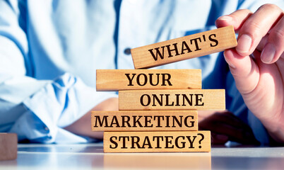 Close up on businessman holding a wooden block with 