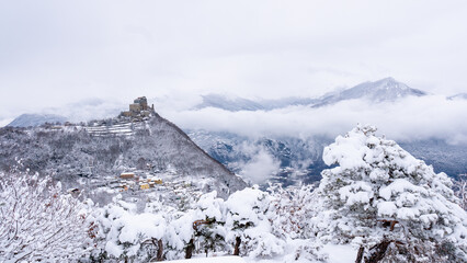 Image of the Ancient/ Abbey of San Michele built on Mount Pirchiriano located at the entrance of the Susa Valley, around the years between 983 and 987 A.D. with an abundant snowfall