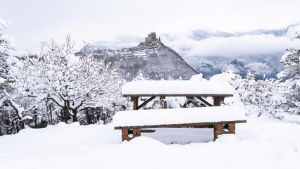 Image of the Ancient/ Abbey of San Michele built on Mount Pirchiriano located at the entrance of the Susa Valley, around the years between 983 and 987 A.D. with an abundant snowfall